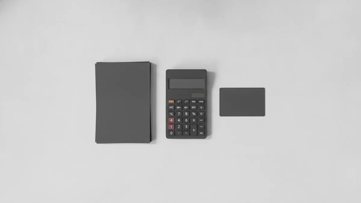 Budgeting trademark costs Calculator and paperwork representing federal trademark filing fees and budgeting