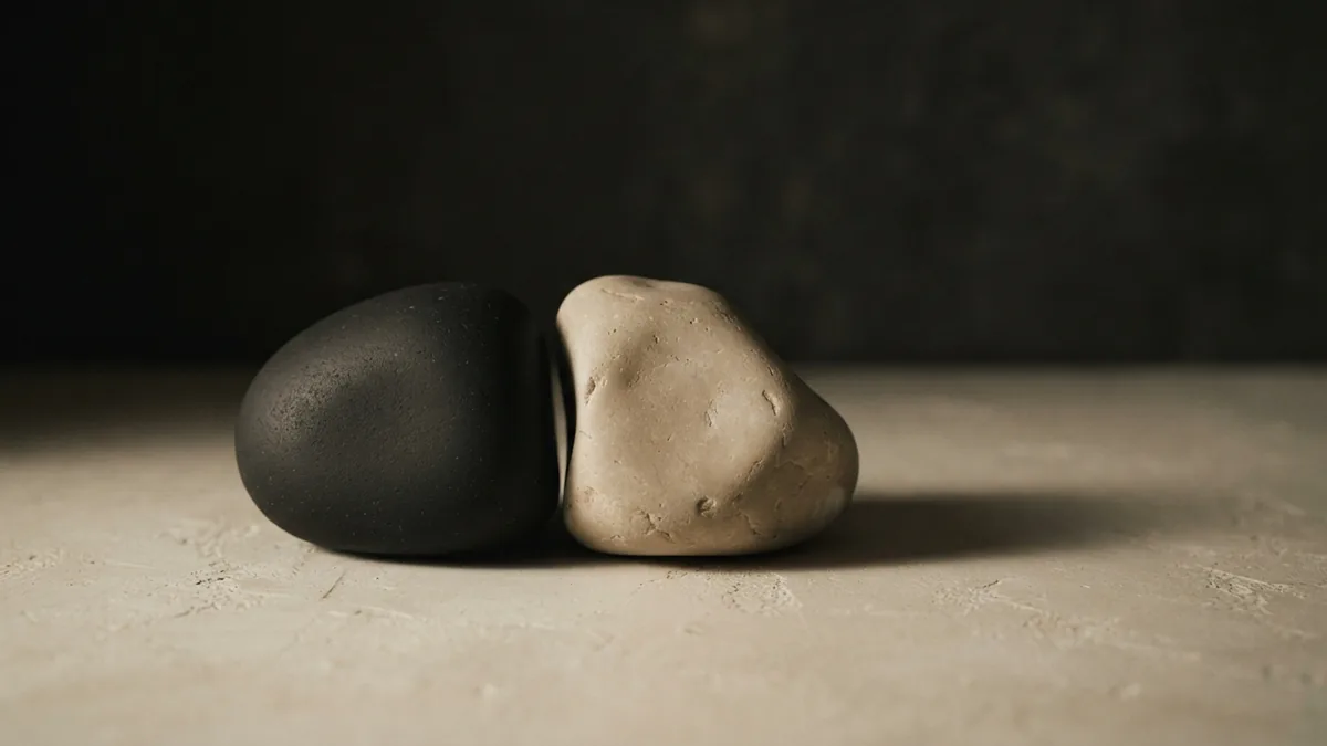 Two similar stone forms set apart to suggest careful comparison of trademark results