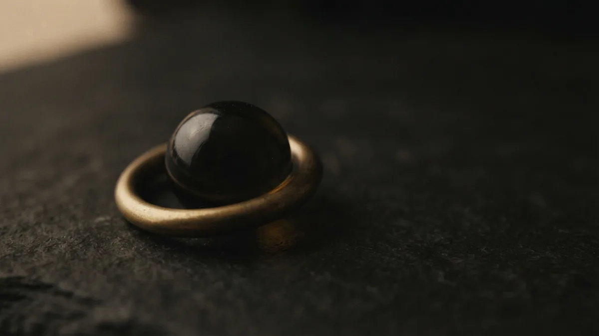 A quiet symbol of hidden financial risk Dark glass marble within a brass ring suggests hidden financial risk and fraud control